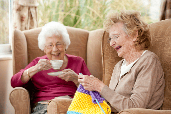 Two older woman laughing and spending time together
