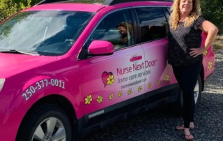 Franchise owner with Nurse Next Door pink car.